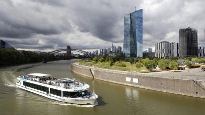 A tourist boat passes on the river next to the ECB headquarters in Frankfurt