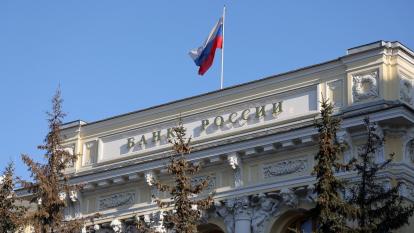 A Russian national flag above the headquarters of Bank Rossii, Russia's central bank, in Moscow, Russia