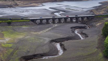 An aerial view of low water levels at Woodhead Reservoir, UK after a record hottest June in 2023