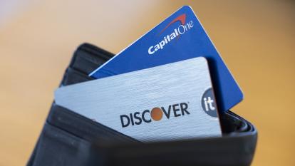 Capital One and Discover credit cards arranged in a wallet
