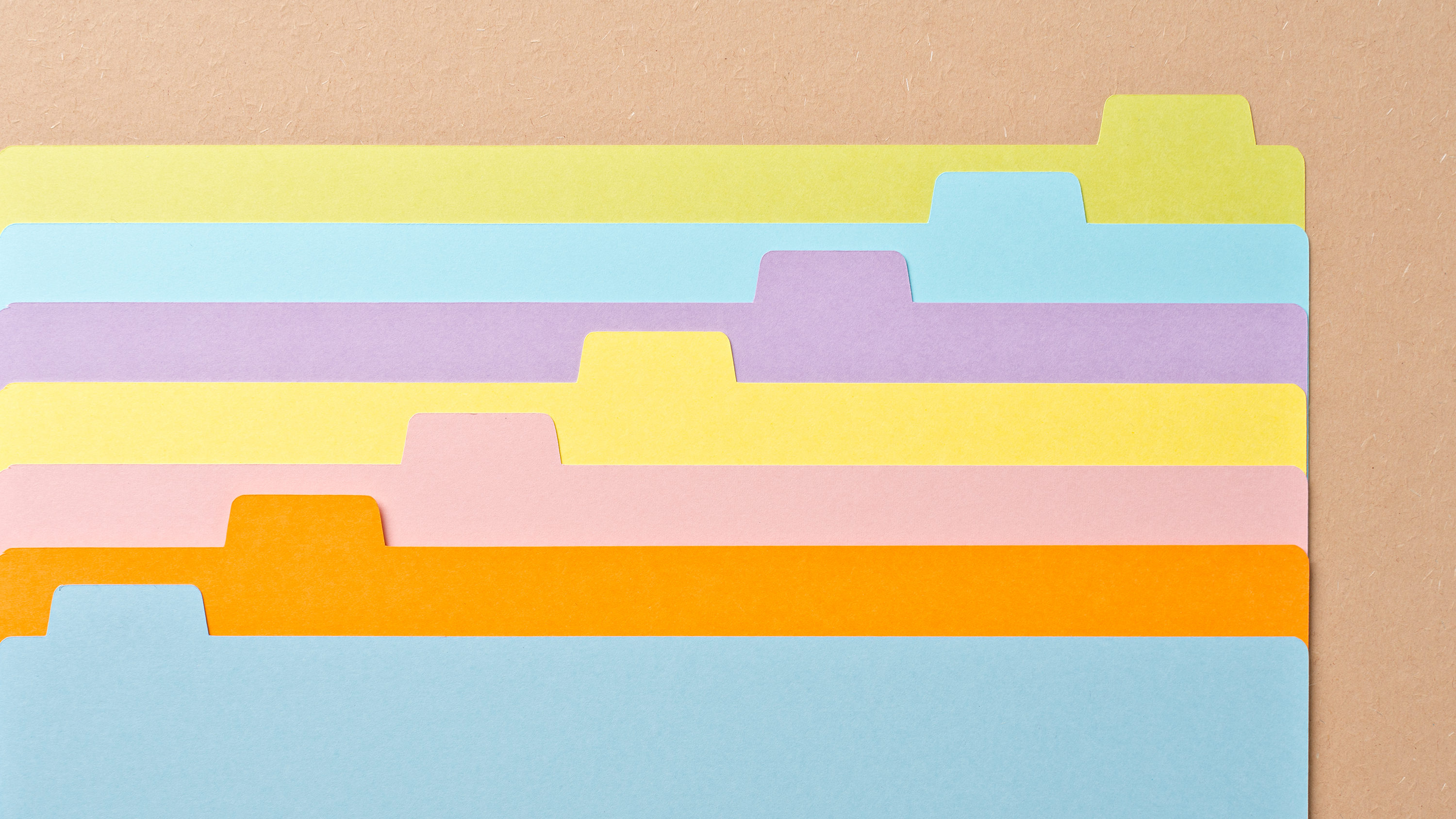 A stack of colourful index cards.