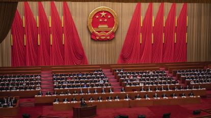 Chinese Premier Li Qiang stands at the podium during his speech at the opening of the National People’s Congress