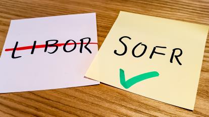 Two sticky notes, one with LIBOR crossed out, the other with SOFR and a tick.