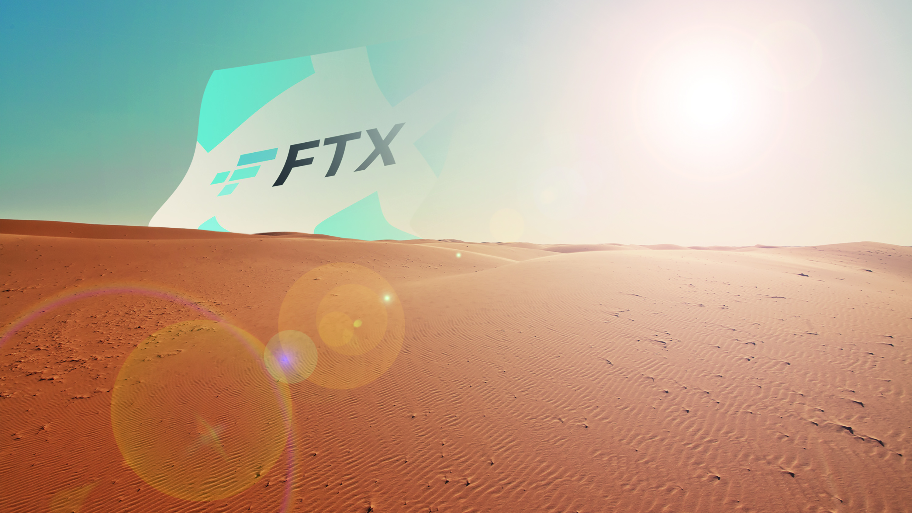 Desert scene with bright sun and FTX logo appearing over horizon