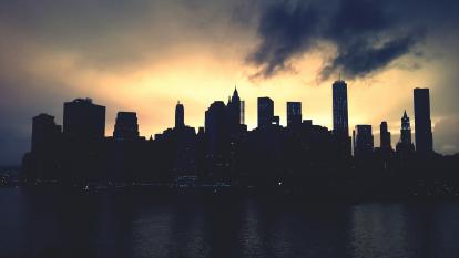 A silhouetted city skyline