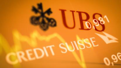 The UBS and Credit Suisse logos over a share prices graph.