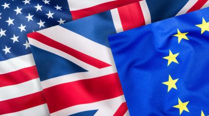 The US, UK and EU flags overlaid on one another.