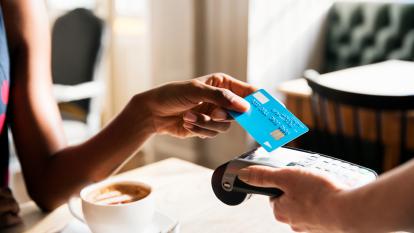 Woman using a debit card
